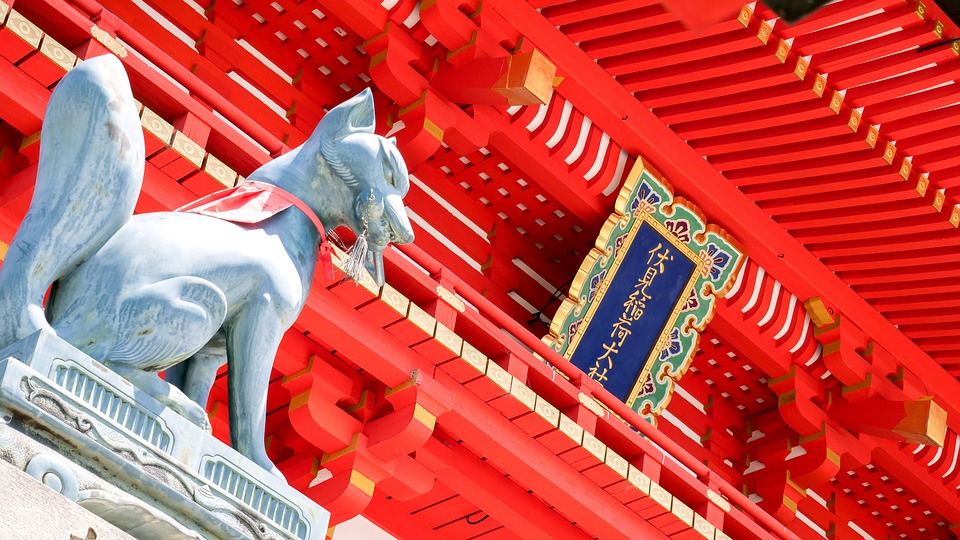 image of a fox statue located on the main shrine building